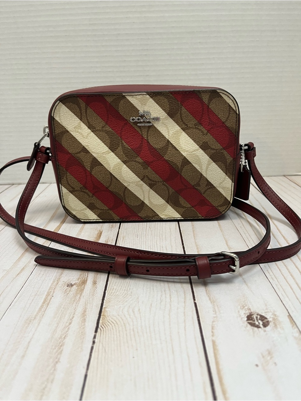 Coach candy stripe mini camera crossbody. Burgundy,tan & brown. EUC. No flaws.